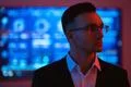 The handsome businessman in glasses on the screen background Photo
