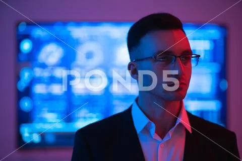 The handsome businessman in glasses on the screen background Stock Photos