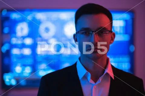 The handsome businessman in glasses on the screen background Stock Photos