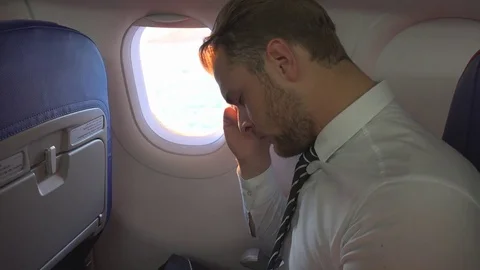 Handsome Businessman Looking Sad Dramatic Upset Expression Airplane Cabin Travel Stock Footage 73611329