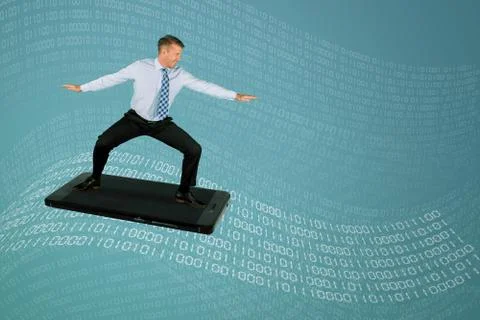 Handsome businessman surfing on binary codes waves Stock Photos