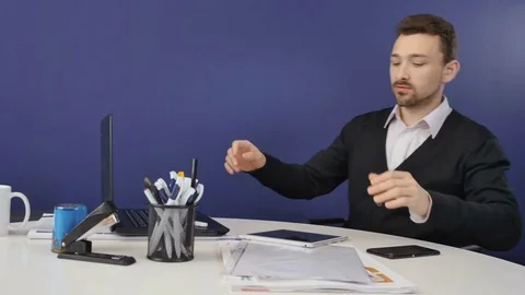 Handsome businessman talks on the phone in the office Stock Footage
