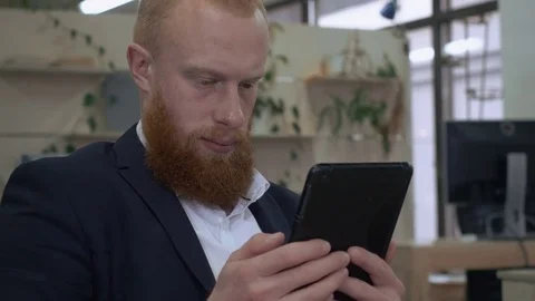 Handsome businessman use gadget Stock Footage 83335778