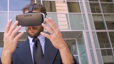 Handsome businessman in virtual reality augmented world with VR goggles Stock Footage 78229307