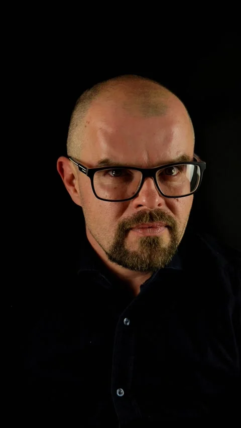 Handsome Caucasian bald man beard and glasses making head gesture indicating no, Video stock 277665652