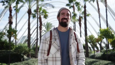 Handsome Caucasian man strolling smiling in Valencia city science park. Joyful Stock Footage 260577114