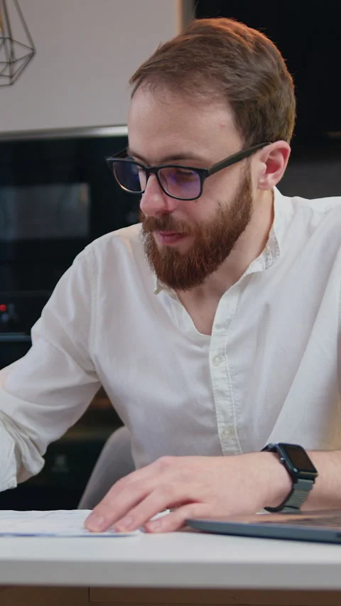 Handsome caucasian man using laptop computer for work in home office. Business m Stock Footage 334676887