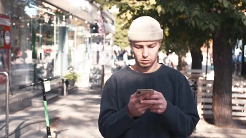 Handsome caucasian man using mobile Phone. Young man texting Messages, chatting Stock Footage 139103346