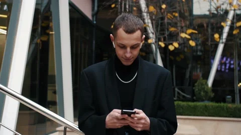 Handsome caucasian man using mobile Phone, texting Messages, cheating on his Video stock 143354656