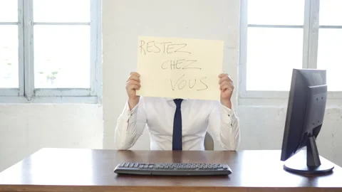 Handsome caucasian worker with office work related signs messages in french: Stock Footage 143263933