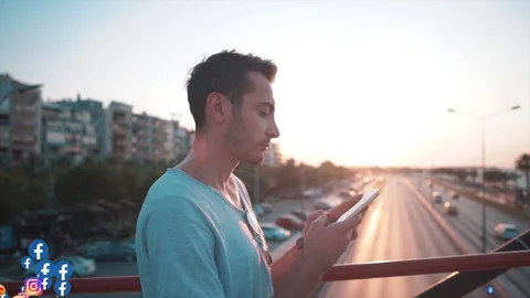 Handsome charismatic Indian guy is looking his phone and his social media likes Stock Footage 122134506