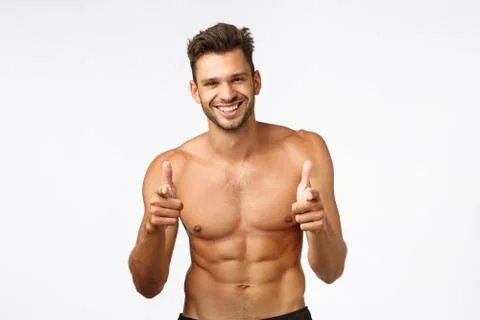 Handsome charming bearded young guy with naked torso, perfect body six-pack Stock Photos