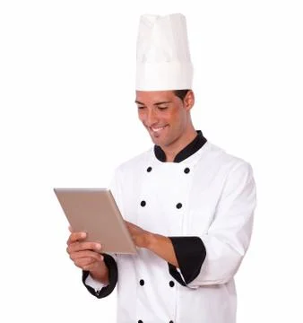Handsome chef guy using his tablet pc Stock Photos