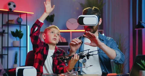 Handsome confident 35-aged bearded man in virtual reality headset studying drone Stock Footage 155650580