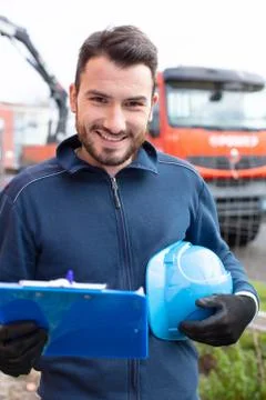 Handsome construction inspector dressed in blue outdoors Stock Photos