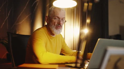 Handsome corporate executive having a video call with business partners Stock Footage 340902361
