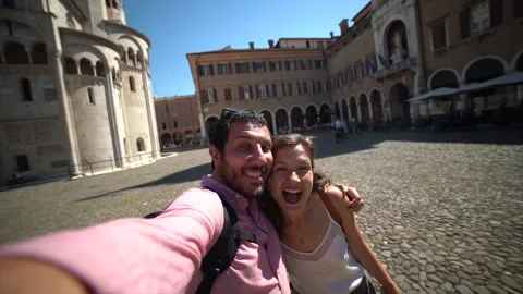 Handsome couple tourist taking selfie photo in Modena, Emilia Romagna, Italy Stock Footage