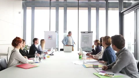 Handsome creative director giving presentation, pointing at flipchart Stock Footage 59544041