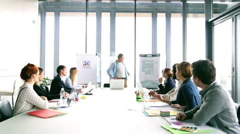 Handsome creative director giving presentation, pointing at flipchart Stock Footage 59544045