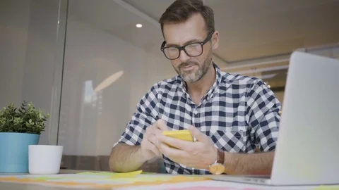 Handsome creative worker writing notes and working in his home office 動画素材 79801017