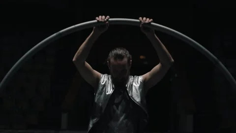 A handsome curly-haired guy with a beard looks at the camera.  Stock Footage 168373501