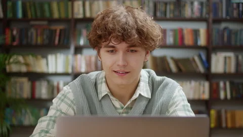 Handsome Curly Student Man Using Laptop Search Information Internet Course Study Stock Footage 205801236