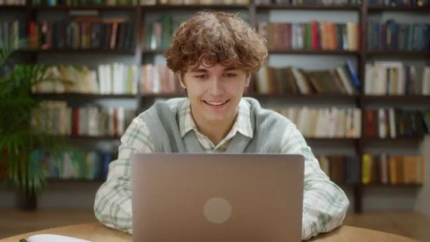 Handsome Curly Student Man Using Laptop Search Information Internet Course Study Stock Footage 222317454