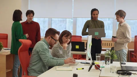 Handsome database developer pointing pencil at computer screen with software Video stock 269165647