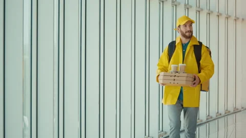 Handsome Delivery Man With Thermal Backpack Brings Pizza Boxes, Coffee Stock Footage 211887739