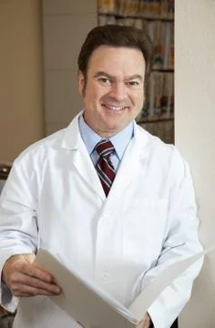 Handsome Doctor with Chart Stock Photos