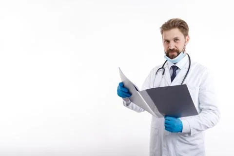 Handsome Doctor Posing With an Open Document Folder Foto stock