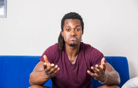 Handsome doubtful black man thinking Stock Photos