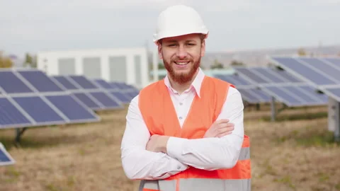 Handsome ecological worker posing with a large smile in front of the camera at Stock Footage 164553754
