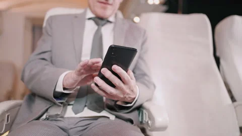 Handsome Elderly Businessman working with digital smartphone on the plan Stock Footage 150349817