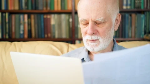 Handsome elderly senior man working on laptop computer at home. Remote freelance Stock Footage 85852889