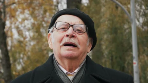 Handsome elderly senior taking deep breath. Old man relaxing breathing in fresh  Stock Footage 143722349