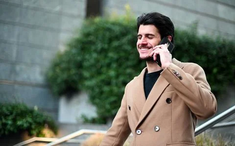 Handsome elegant dressed man talking on the phone Stock Photos