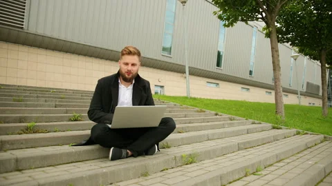 Handsome elegant man working outside, focused laptop, enjoying, bearded hipster Stock-Footage 134668166