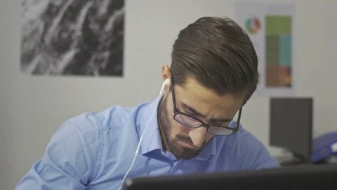Handsome employee working on the computer in the modern office Stock Footage 73990876