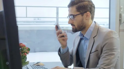 Handsome employee working on the project in the office Stock Footage 73990488