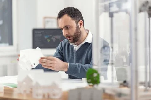 Handsome engineer checking 3D model of house Foto stock