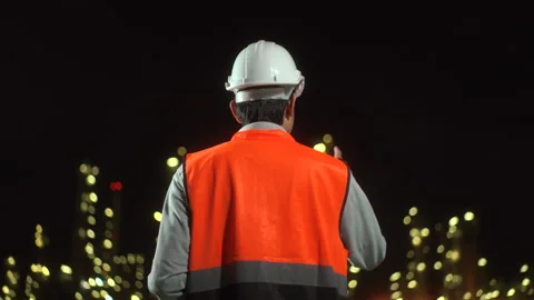 Handsome engineer man inspection discussion with tablet walking front of oil. Stock Footage 273462781