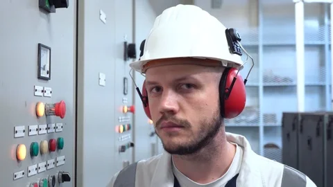 Handsome engineer stands near hydropack system panel Stock Footage 115250409
