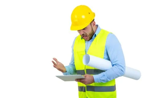 Handsome engineer working with a tablet pc, isolated on white Stock Photos