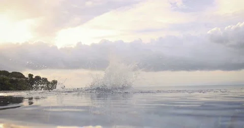 Handsome fit man jumping in the pool water outdoor by the beach 스톡 동영상 151549536