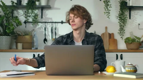 Handsome freelancer is with important documents at his kitchen. Work from home Stock Footage 146802146