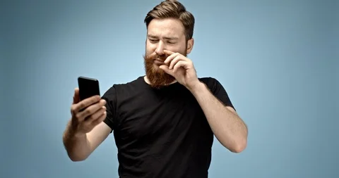 Handsome ginger haired caucasian young hipster man with mustache and beard Stock Footage 112296880