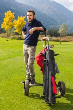 Handsome golf player Stock Photos
