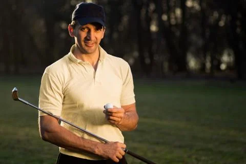 Handsome golf player Stock Photos