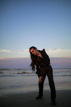 Handsome goth dark vampire emo guy with long hair Stock Photos
